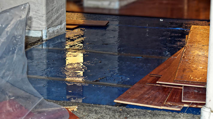 A damaged floor caused by a slab leak.