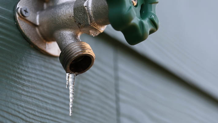 Shut off water to hose bibbs during freezing weather