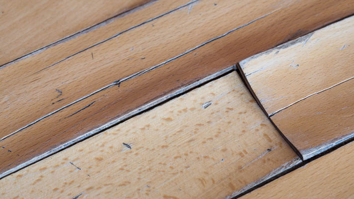 Wood flooring damaged by a slab leak